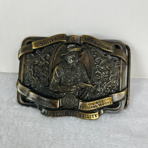 Vintage 1989 Smith & Wesson Bergamont Absolute Reliability Brass Belt Buckle - Picture 1 of 6
